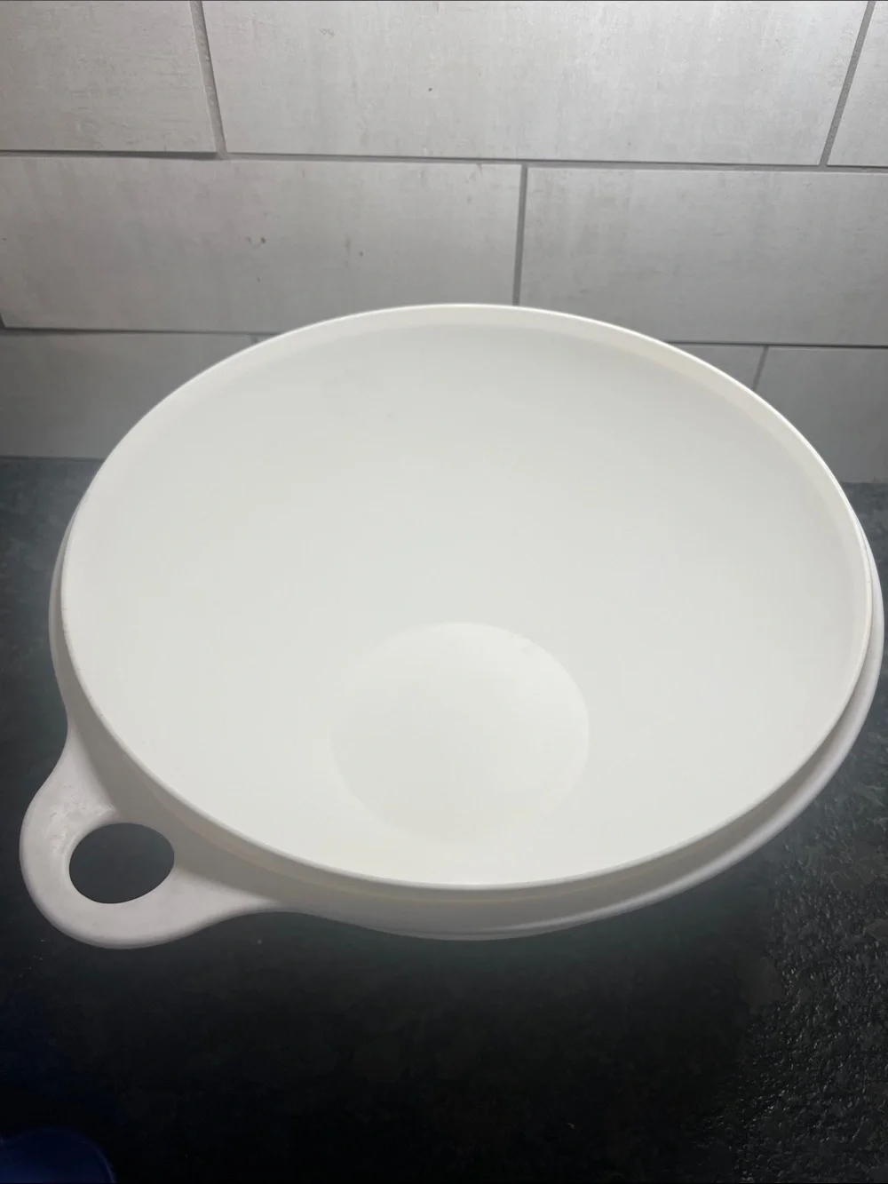 That’s a Bowl Tupperware Mixing Bowl with Blue Lid - White Bowl. 32 cup.